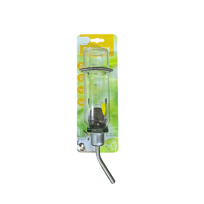 A packaged pet water bottle feeder with a clear glass measuring cylinder, metal collar, and angled metal tube, mounted on a green and yellow retail card.