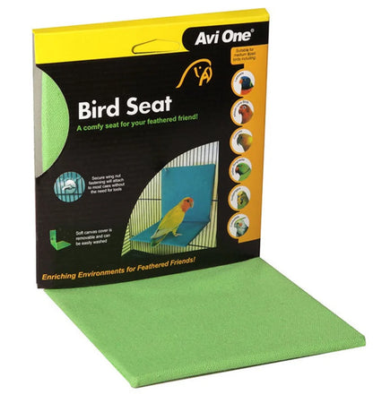 A green Avi One bird perch cover shown partially extended from its black and yellow retail packaging, with a small bird perched inside the printed photo on the box.
