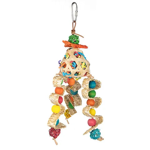 A colorful bird toy hanging from a metal clip, featuring a woven natural fiber body with multicolored fabric panels and dangling beads in orange, yellow, green, blue, pink, and red.