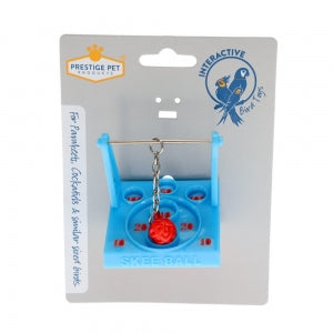 Prestige Pet Products Interactive Skee Ball toy for birds, shown in its original retail blister packaging. The toy features a light blue plastic base with numbered slots (10, 20, 30) and a red spherical skittle hanging from a metal rod.