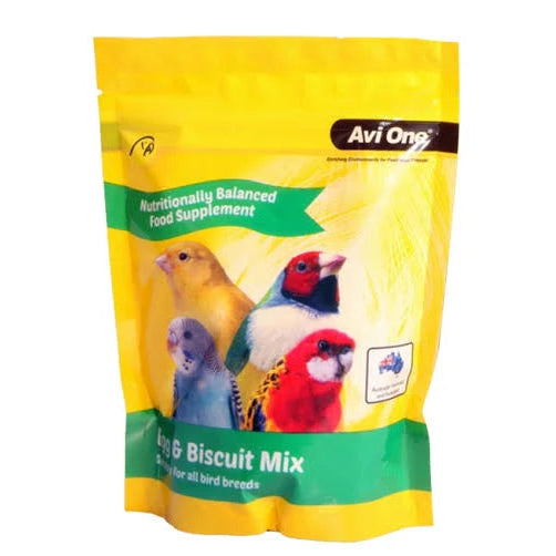 A yellow stand-up pouch of Avi One Bird & Biscuit Mix food supplement for all bird breeds, featuring images of several colorful birds on the front.